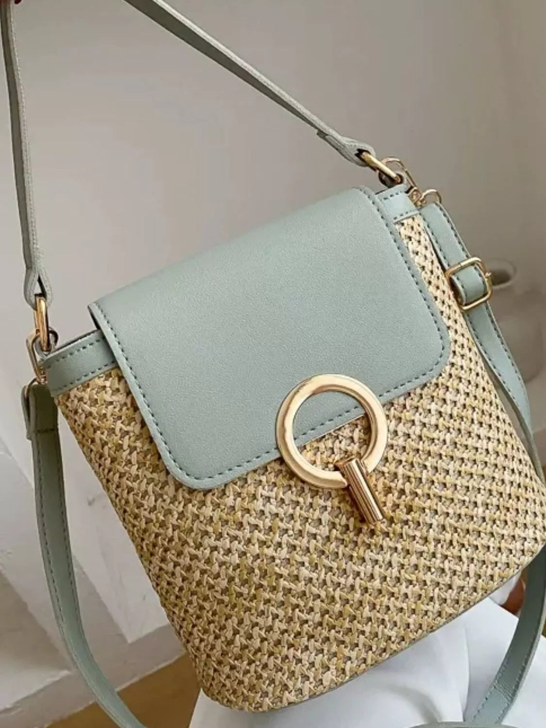 Woven straw crossbody bag with faux-leather trim and front pocket, summer shoulder bag
