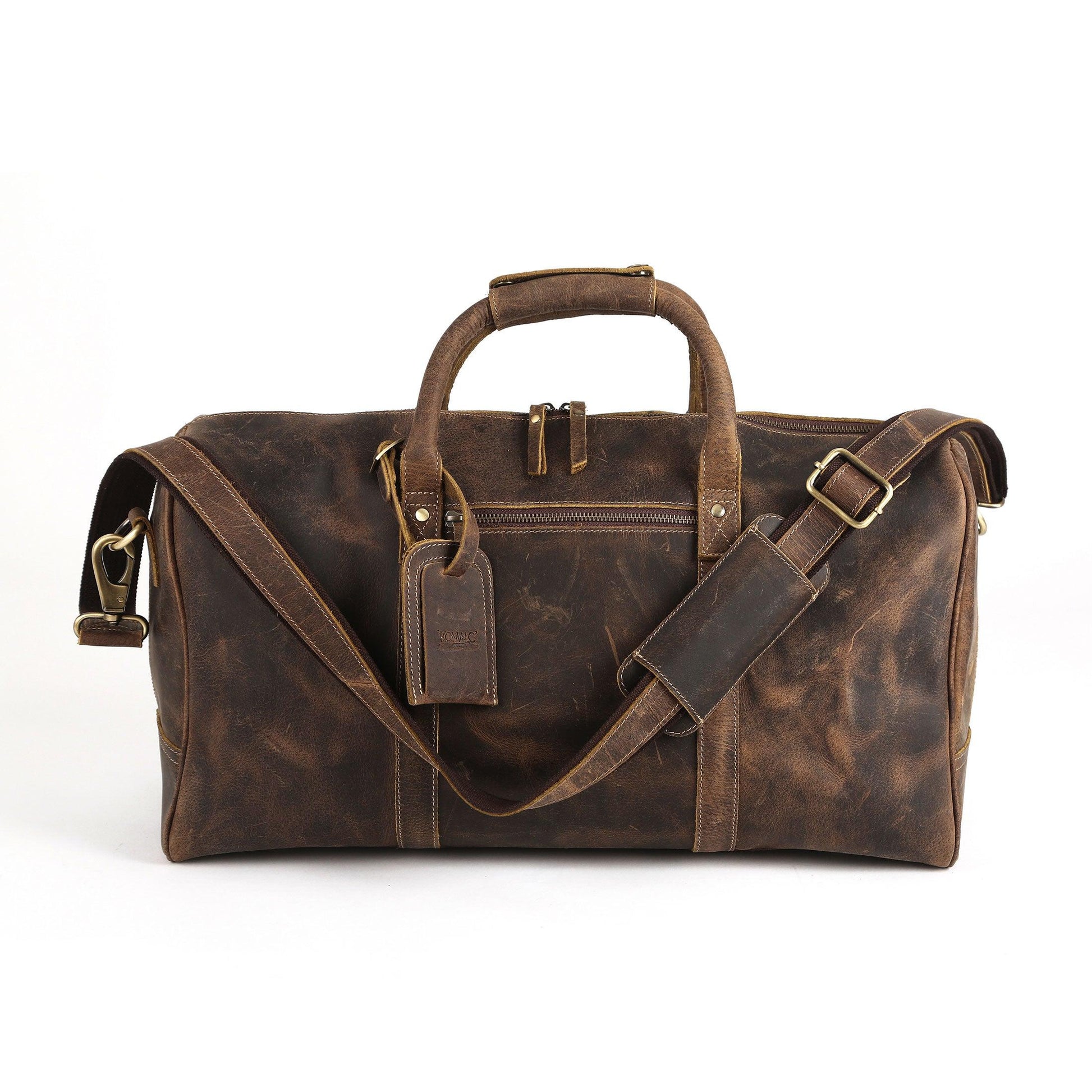 Vintage brown leather duffel bag with grab handles and shoulder strap