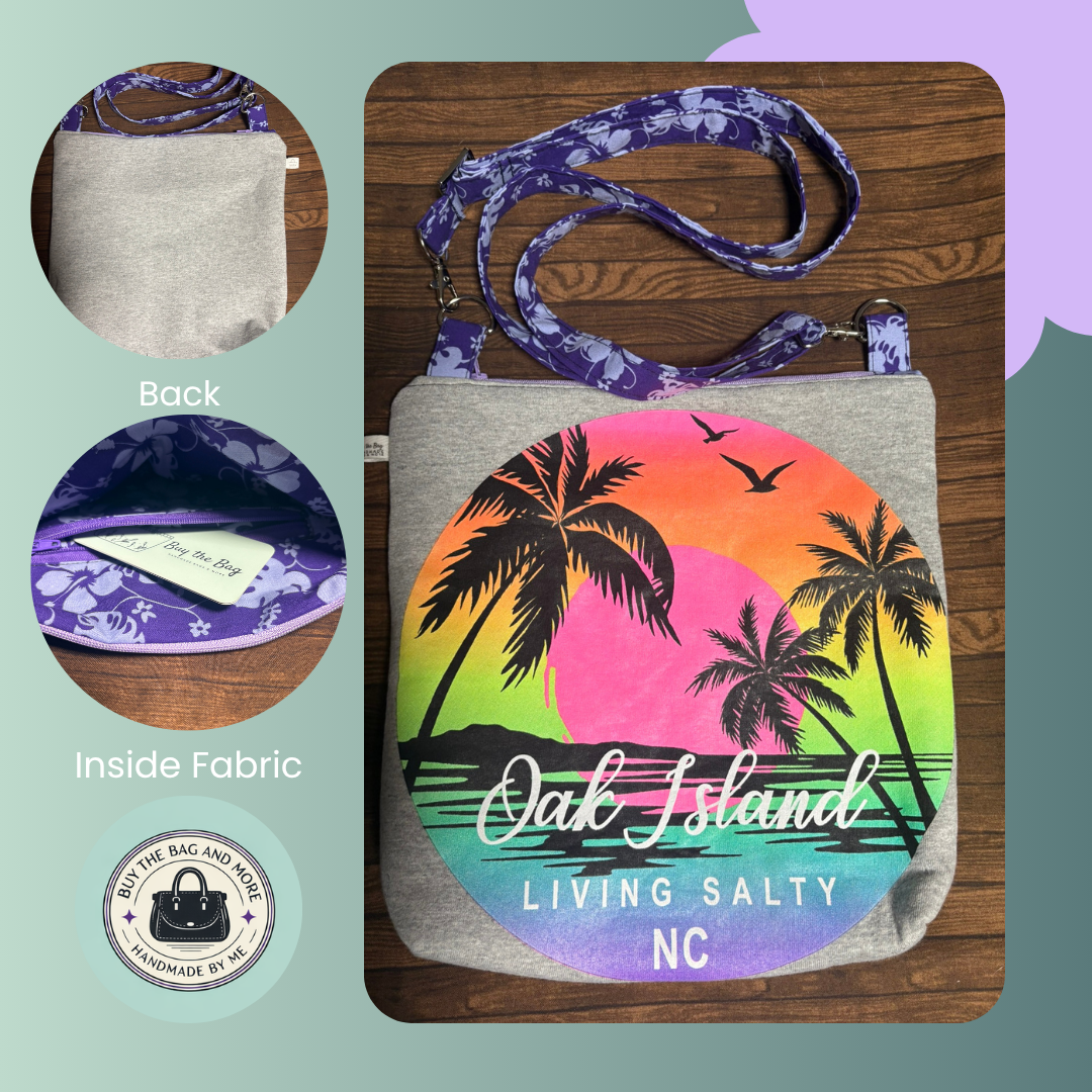Pouch with palm tree design and 'Oak Island Living Salty NC' text on a wooden surface.