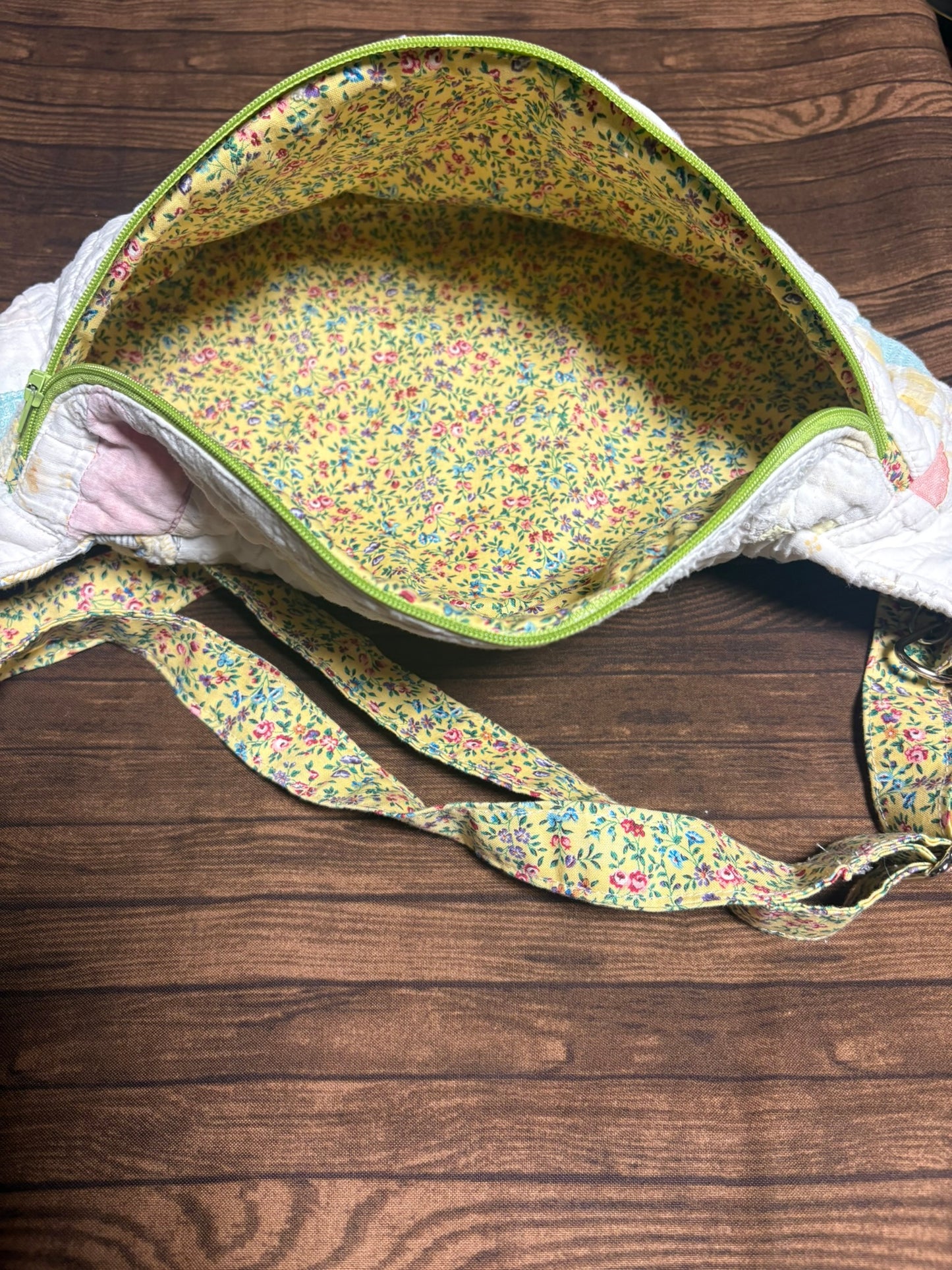 Floral-patterned bag on a wooden surface