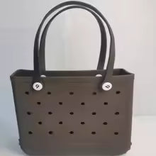 Brown handbag with black polka dot pattern on a white background