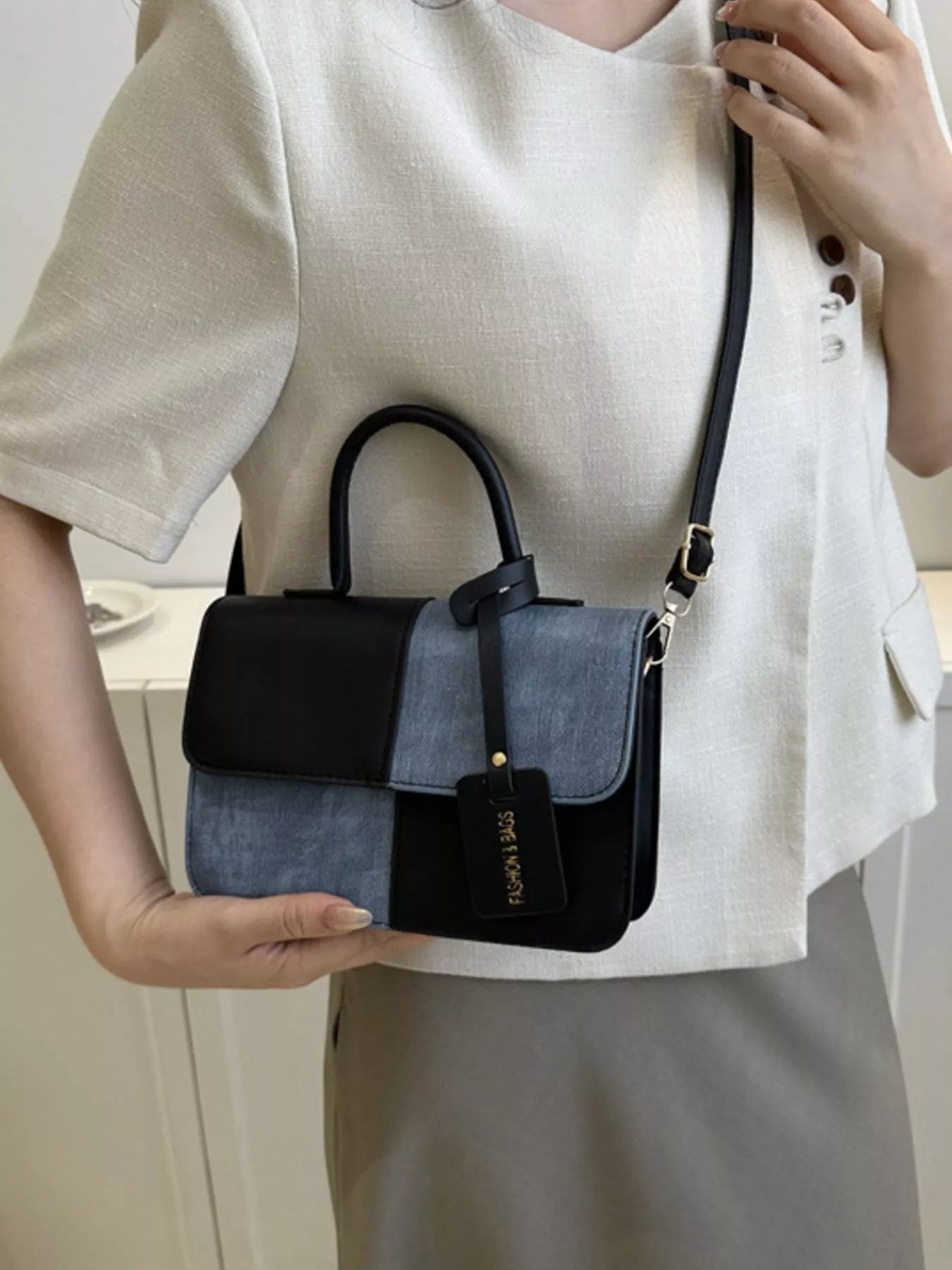 Structured two-tone PU leather mini crossbody handbag with top handle and shoulder strap