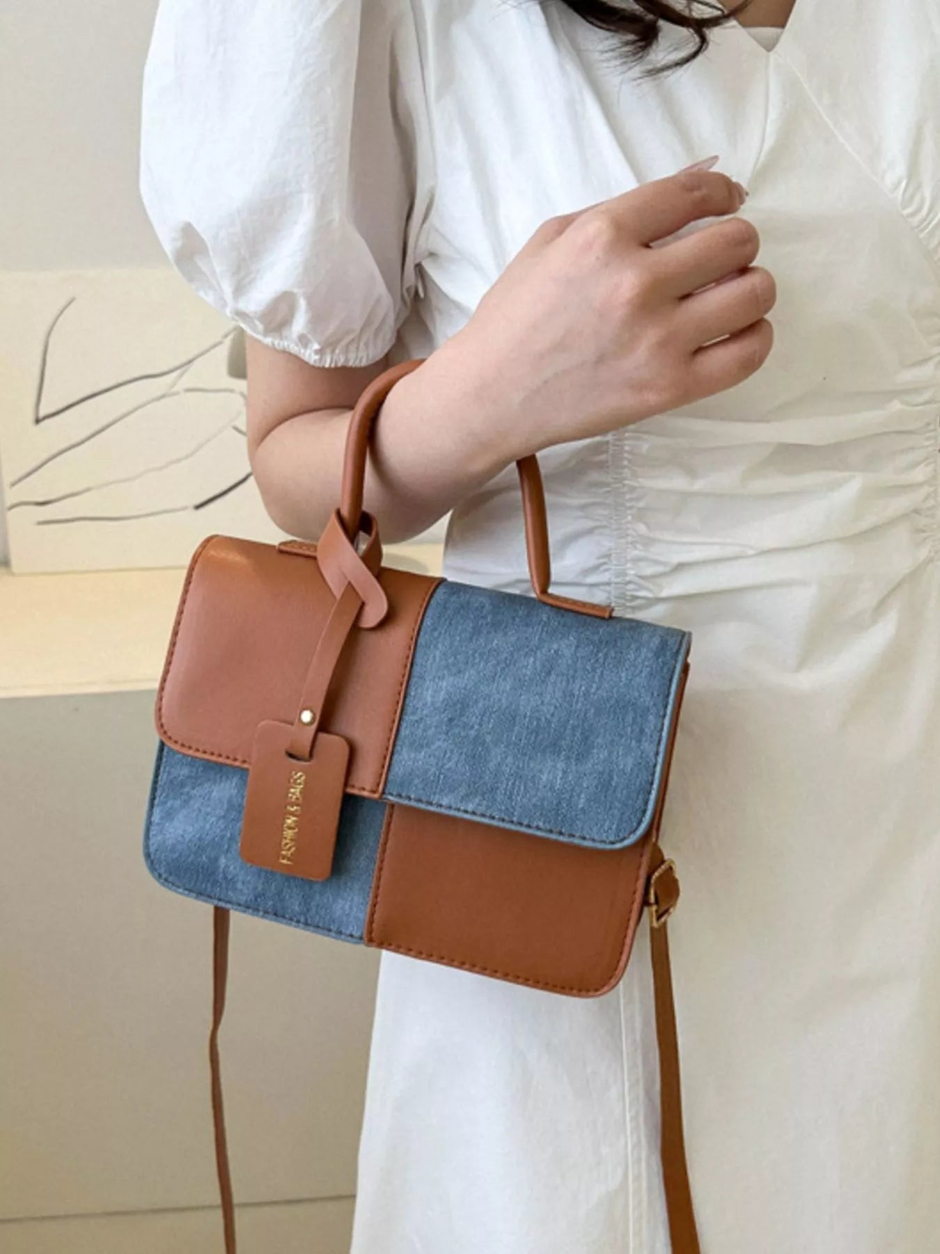 Structured two-tone PU leather mini crossbody handbag with top handle and shoulder strap-arm