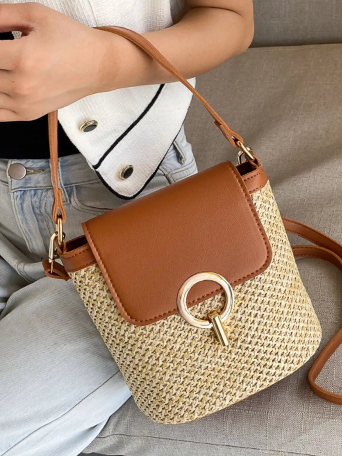 Woven straw crossbody bag with faux-leather trim and front pocket, summer shoulder bag